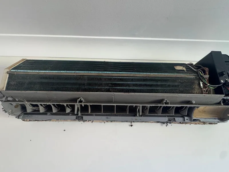 Indoor split-system coil and air outlet before cleaning